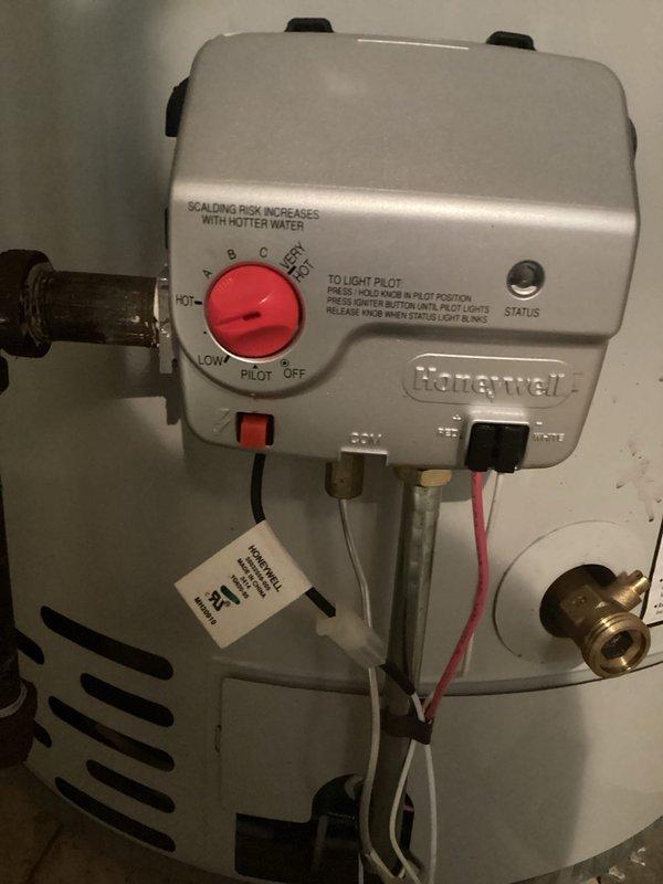 Responded to no hot water complaint at residential property. Upon arrival, inspected Bradford White Defender Safety System tanked water heater in basement utility area. Examined gas control valve and pilot assembly on unit. Found Honeywell gas control valve in OFF position. Relit pilot light following manufacturer's lighting procedures, verified proper flame characteristics, and restored gas control to operational temperature setting. Confirmed hot water restoration and proper unit function before departure.
