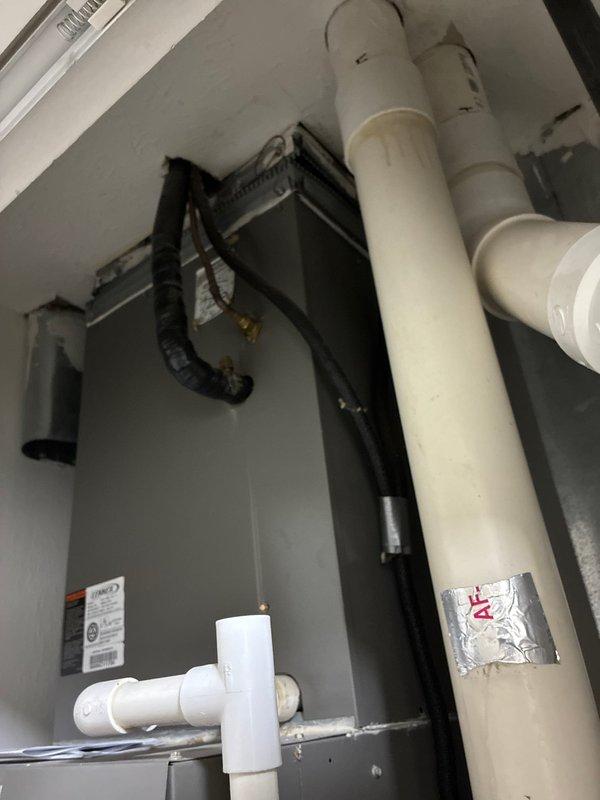 Provided full system replacement estimate for 20-year-old Lennox HVAC system located in closet area of stand-alone condo home. Presented three Goodman equipment options: Good tier with up to 13.4 SEER A/C and 80% AFUE gas furnace, Better tier with up to 14 SEER A/C and 96% AFUE gas furnace, and Best tier with up to 16 SEER A/C and 96% AFUE gas furnace. Documented existing equipment location and site layout for replacement planning.