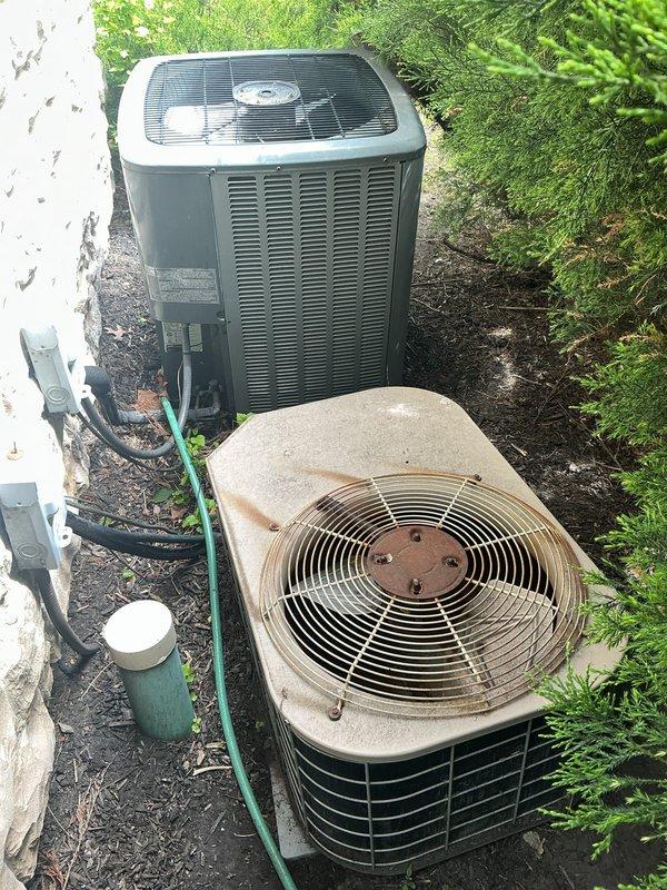 Responded to no heat call on residential HVAC system where previous contractor suspected thermostat wiring issue but was unable to diagnose. Upon arrival, inspected outdoor condensing units and found aging equipment with visible corrosion and weathering on older unit. Performed diagnostic testing on thermostat wiring, traced control circuits, and identified wiring fault that was preventing proper system operation. Corrected thermostat wire connection issue, verified proper system communication, and restored heat functionality to unit.