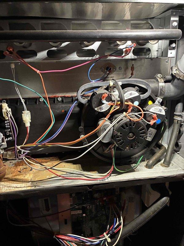 Replaced failed collector box that was actively leaking water, causing corrosion and rust damage to surrounding components. Removed old corroded unit, installed new collector box assembly, and verified proper drainage function with no leaks upon completion.