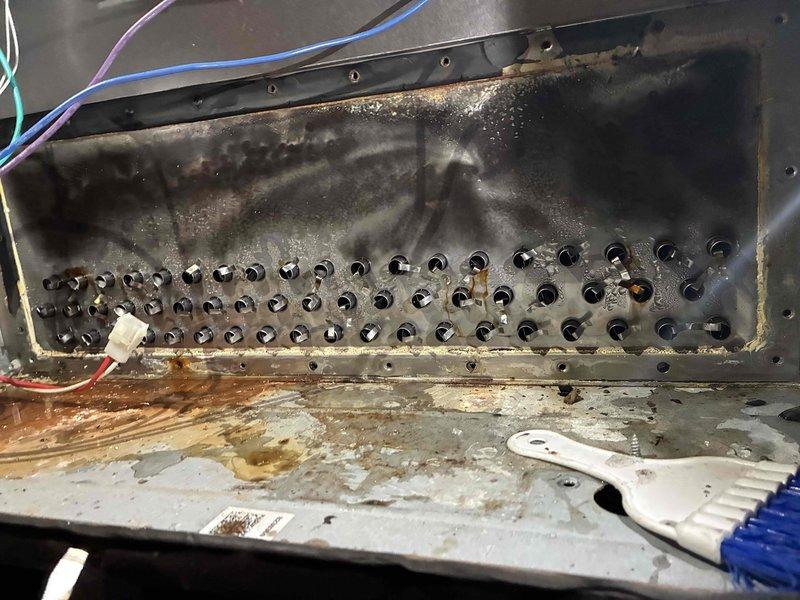 Replaced failed collector box that was actively leaking water, causing corrosion and rust damage to surrounding components. Removed old corroded unit, installed new collector box assembly, and verified proper drainage function with no leaks upon completion.