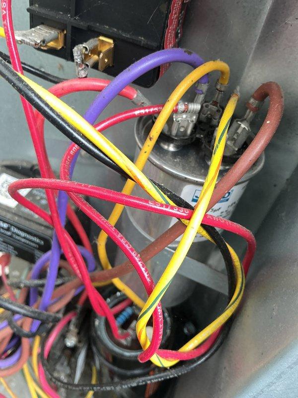 Performed comprehensive cooling system maintenance on residential HVAC unit. Connected manifold gauge set to service ports and verified refrigerant pressures and system performance. Inspected evaporator coil assembly, confirming proper heat exchange function and adequate airflow through fin configuration. All components operating within normal parameters, system ready for cooling season.