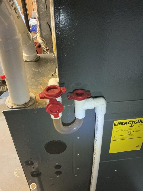 Completed routine HVAC cooling maintenance on residential P.K. Wadsworth furnace and air handler system. Inspected refrigerant lines, condensate drainage system with PVC piping and ball valves, and verified all safety labels and operational components were intact and functioning properly.