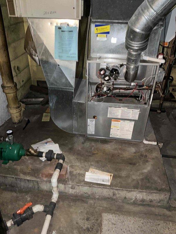 Conducted on-site HVAC estimate for furnace replacement system. Evaluated existing gas furnace installation in basement utility area, documented current equipment configuration including ductwork connections and PVC condensate drainage system, and provided homeowner with replacement options and preliminary measurements for new system installation.