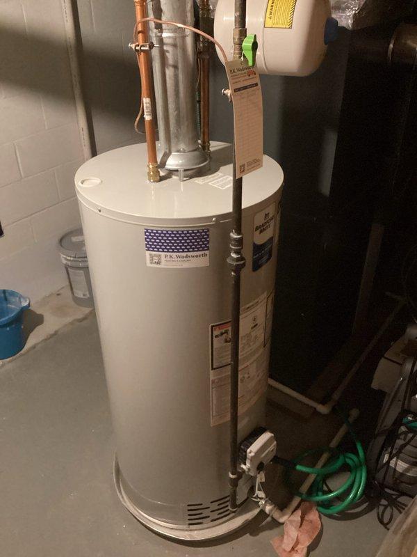 Performed routine maintenance on tanked water heater system, including complete flush procedure to remove sediment buildup and ensure optimal performance. Inspected all connections, valves, and associated components including expansion tank, copper supply lines, and brass fittings, confirming proper operation and no visible leaks or deterioration throughout the system.