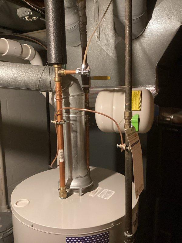 Performed routine maintenance on tanked water heater system, including complete flush procedure to remove sediment buildup and ensure optimal performance. Inspected all connections, valves, and associated components including expansion tank, copper supply lines, and brass fittings, confirming proper operation and no visible leaks or deterioration throughout the system.