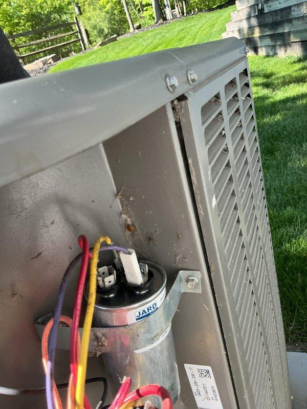 Responded to no cooling complaint on residential air conditioning system. Upon arrival, performed diagnostic testing of outdoor unit electrical components using clamp meter. Identified failed dual-run capacitor as root cause of system malfunction. Replaced defective JARD capacitor with new unit, reconnected all electrical terminals, and verified proper wire connections. Tested system operation and confirmed unit returned to normal cooling function.
