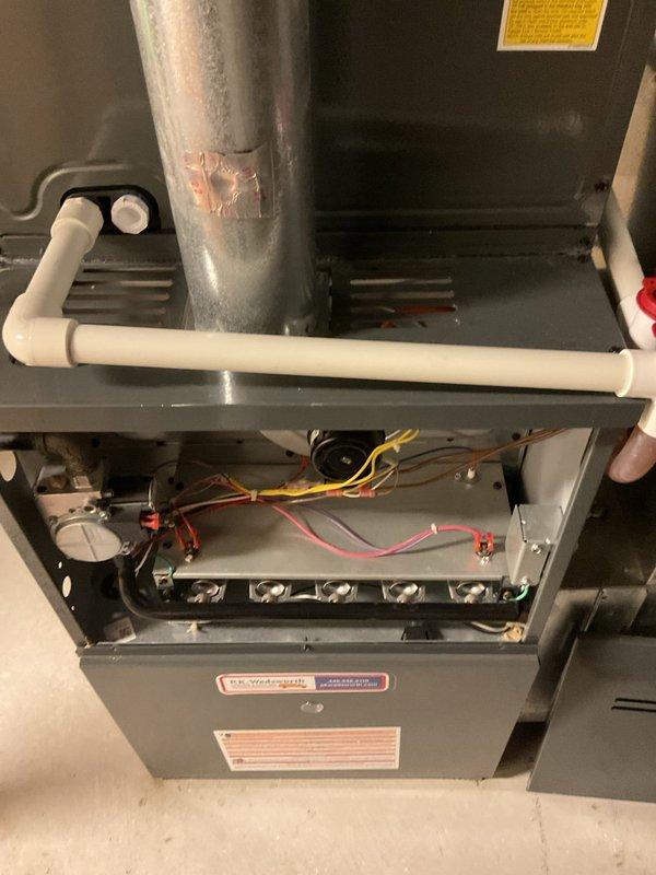 Performed comprehensive preventive maintenance on residential split-system HVAC cooling equipment. Inspected indoor furnace unit and outdoor condensing unit, verifying proper operation of all electrical components including capacitor, contactor, and control wiring connections. Confirmed gas furnace burner assembly condition, checked condensate drainage system, and documented equipment status through detailed photographic records. All systems tested and found operating within normal parameters with no deficiencies noted at time of service.
