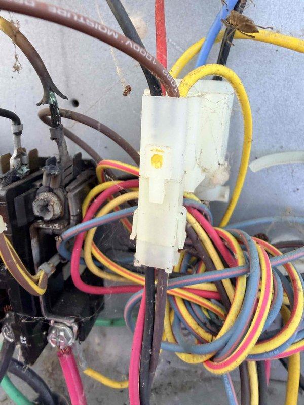 Responded to service call for air conditioning system inspection following reported hail storm damage. Upon arrival, performed comprehensive visual assessment of outdoor condensing unit and associated components. Inspection revealed significant corrosion on refrigerant line connections and valve assemblies, along with weathered electrical wiring and terminal connections showing age-related deterioration. Documented equipment condition with photographs showing rusted mechanical components, discolored wiring harnesses, and corroded pipe fittings. No visible hail damage was identified during inspection; observed issues appear related to normal wear and environmental exposure rather than storm-related impact.