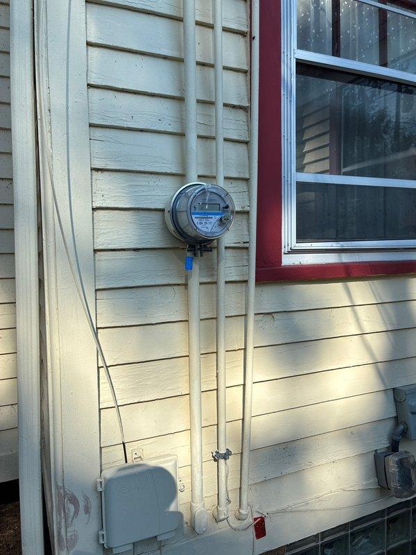 Conducted on-site evaluation for furnace replacement options at residential property. Documented existing HVAC system configuration including outdoor condensing unit installed on side of home with proper clearances and drainage. Assessed electrical service connections, metering equipment, and conduit routing for compatibility with potential new equipment installations. Photographed current system setup and surrounding access points to determine optimal replacement approach and equipment specifications. Provided homeowner with furnace replacement options based on existing infrastructure and system requirements.