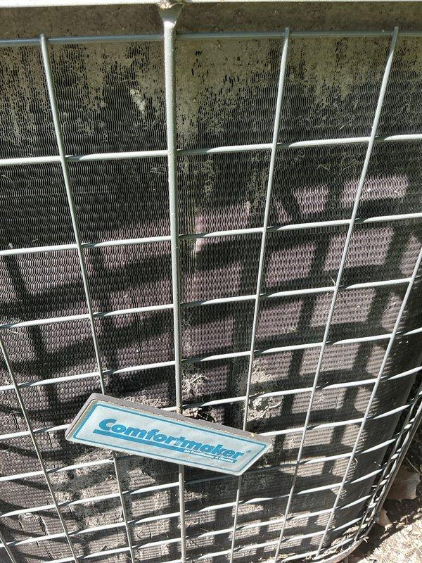 Performed comprehensive cooling system tune-up on Comfortmaker unit, addressing previous rattling concern reported during earlier furnace installation. Verified and re-secured loose components, conducted full system diagnostics using refrigerant manifold gauges confirming proper superheat levels and refrigerant charge, and noted significant debris accumulation on exterior condenser coil mesh requiring future cleaning attention to maintain optimal airflow and efficiency.