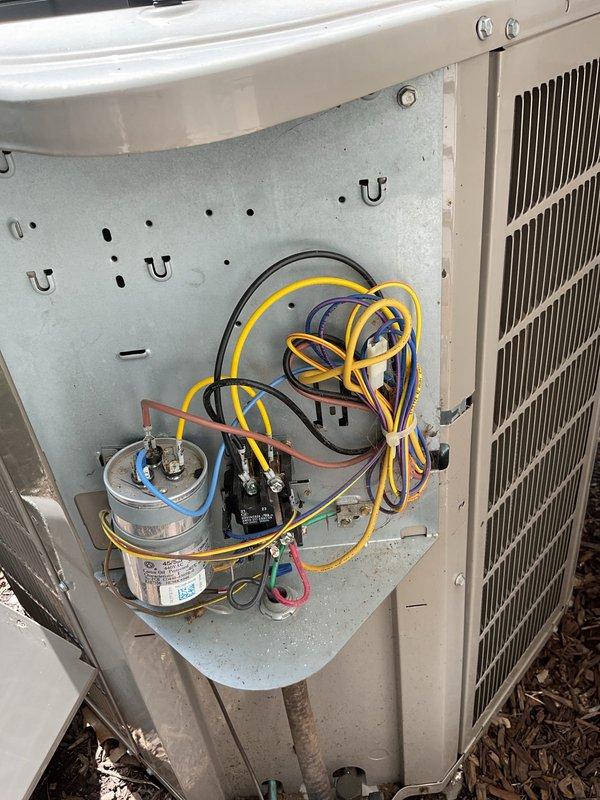 Completed comprehensive cooling system maintenance on residential split HVAC system. Performed thorough inspection of outdoor condensing unit, verifying proper operation of compressor contactor, dual-run capacitor, and all electrical connections. Inspected condenser coil fins for damage and blockage, confirmed adequate airflow through heat exchanger. Examined indoor air handler and evaporator coil assembly, checked refrigerant line insulation integrity, and verified condensate drainage system functionality. Replaced air filtration media and confirmed proper system operation upon completion of preventive maintenance service.