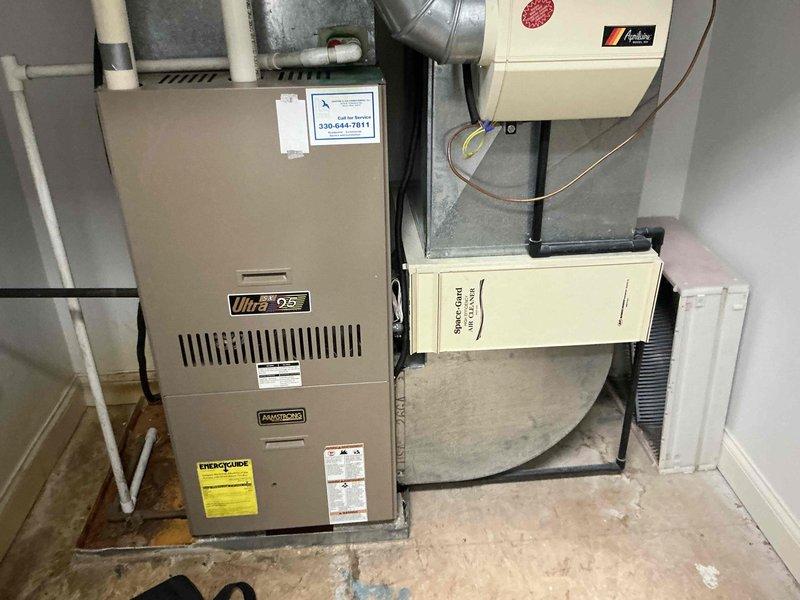 Conducted site assessment at rental property with multiple HVAC systems to provide replacement estimate options. Evaluated non-functional air conditioning system serving master bedroom area, documenting existing equipment configuration including three outdoor condensing units and indoor air handler with Ultra 96 furnace. Presented full system replacement options to property owner, photographed current installation showing refrigerant line routing, electrical connections, and ductwork layout to support equipment sizing and replacement specifications.