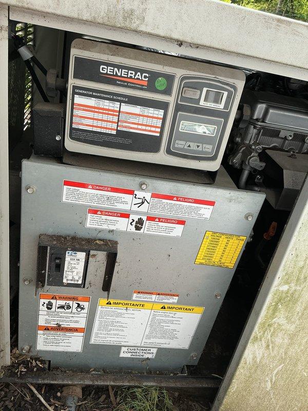 Responded to service call for Generac backup generator that failed to activate during neighborhood power outage. Upon arrival, performed visual inspection of unit and control panel, noting accumulation of debris and environmental contamination on exterior surfaces and electrical compartment. Inspected Eaton Cutler-Hammer Power Defense circuit breaker panel (125A rating) and internal generator control interface with maintenance schedule display. Documented current condition of unit showing weathering, dirt buildup, and operational status indicators. Unable to locate illuminated status light as reported by customer, suggesting potential control panel malfunction or power supply issue to monitoring system.