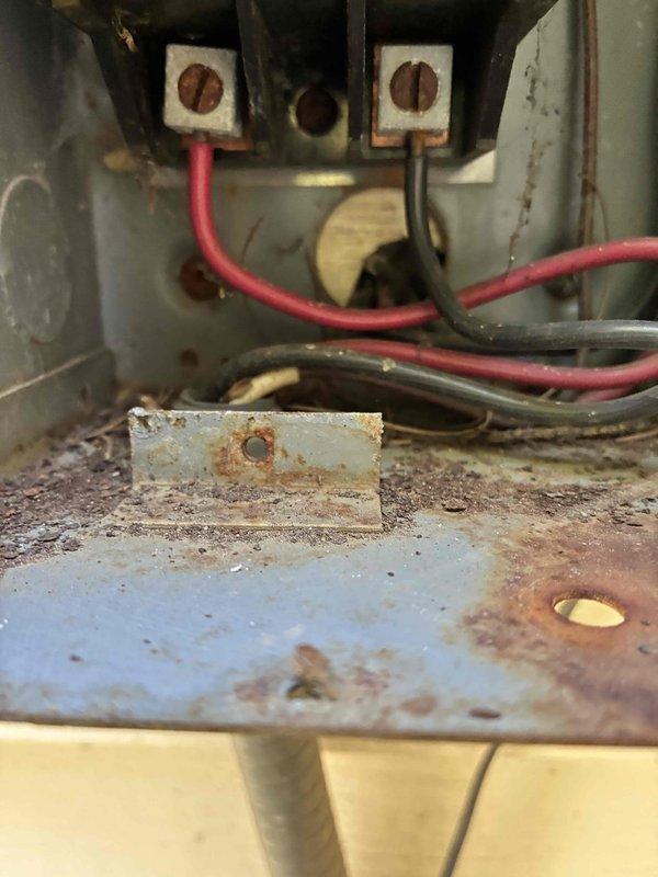 Completed preventive maintenance on cooling system including inspection of electrical components and control wiring. During inspection, identified significant rust and corrosion on electrical panel base plates and mounting hardware, along with aged wire insulation showing signs of degradation. Documented existing conditions of terminal blocks, junction points, and multi-circuit wiring connections for future reference and potential replacement recommendations.
