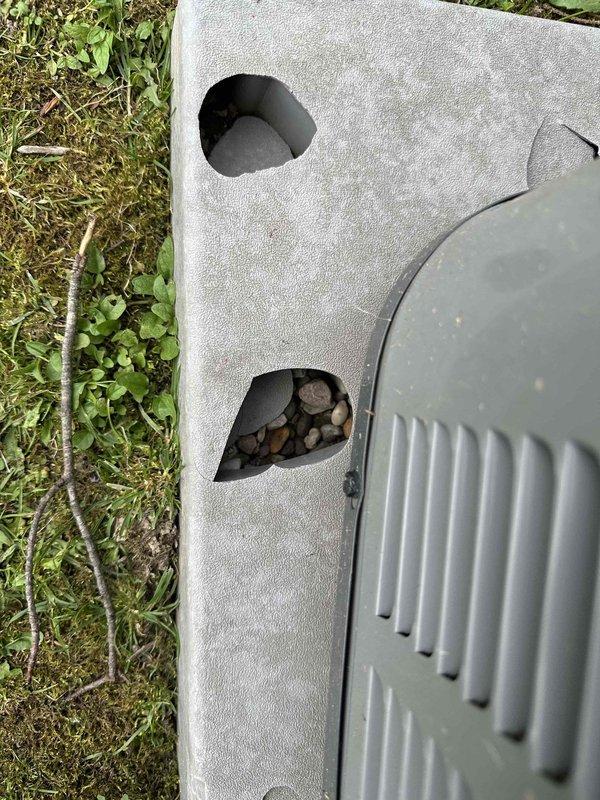 Responded to no cooling complaint with indoor temperatures reaching into the 80s. Upon inspection of outdoor condensing unit, discovered significant damage to foam insulation cover with multiple openings allowing debris accumulation and wildlife intrusion into unit compartment. Found sticks, leaves, and nesting materials lodged inside equipment through deteriorated insulation panels. Removed all debris from unit, assessed condenser for proper operation, and advised on necessary insulation replacement to prevent future wildlife access and maintain equipment efficiency.