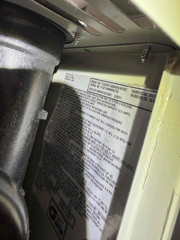Responded to no cooling complaint on central air conditioning system. Upon arrival, confirmed outdoor condensing unit operating but indoor air handler not delivering cool air. Inspected Trane air handler unit manufactured in 2011, removed access panel and performed diagnostic testing of internal components including circuit board, wiring connections, and mechanical assemblies. Identified system malfunction preventing proper cooling operation. Evaluated refrigerant lines, electrical connections, and control systems to determine root cause of cooling failure. Documented equipment condition with photographs showing internal components and manufacturer specifications for 2-ton capacity unit.