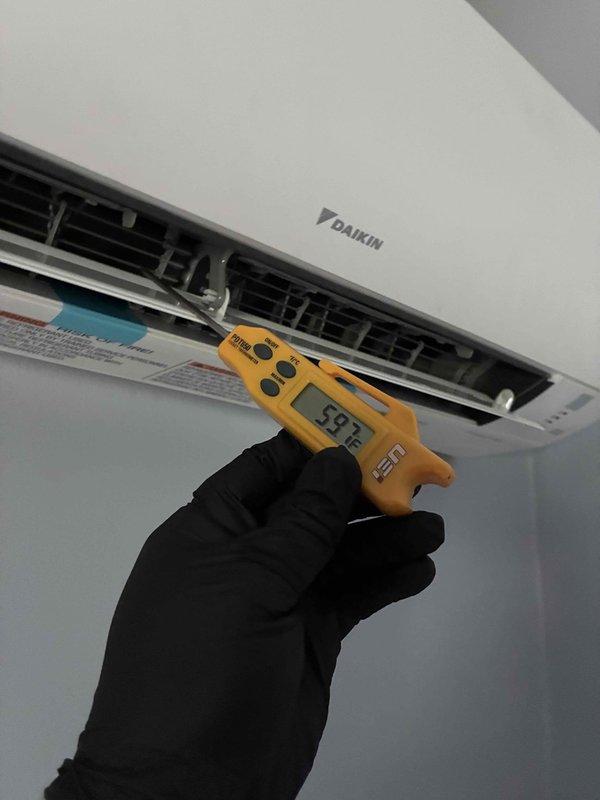 Responded to UH error code on Daikin mini split system. Diagnosed and resolved the issue, verified proper operation with temperature readings showing 59.2°F at discharge vents. Inspected outdoor unit and condensate drainage lines to ensure system functionality and proper installation integrity.