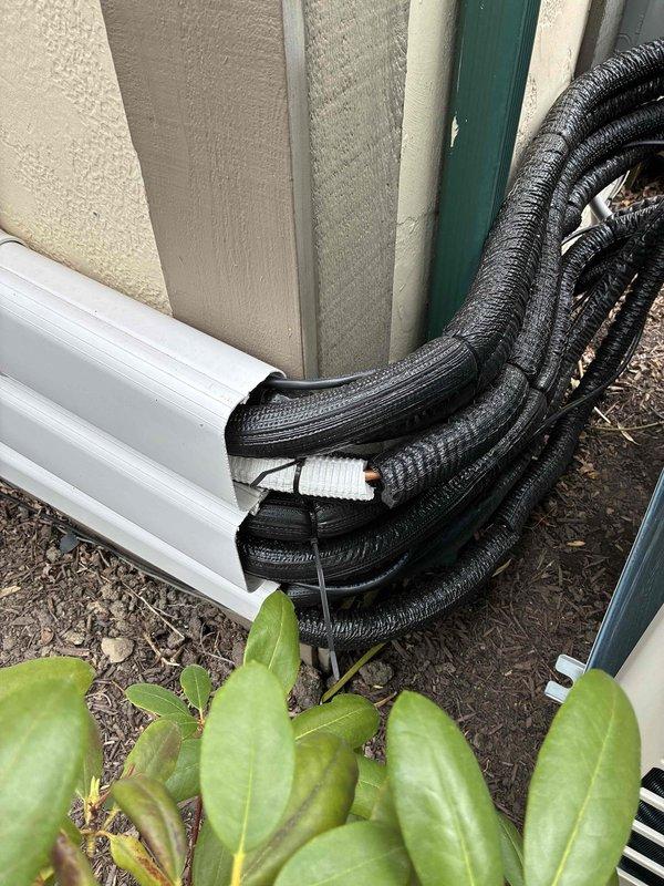 Responded to UH error code on Daikin mini split system. Diagnosed and resolved the issue, verified proper operation with temperature readings showing 59.2°F at discharge vents. Inspected outdoor unit and condensate drainage lines to ensure system functionality and proper installation integrity.