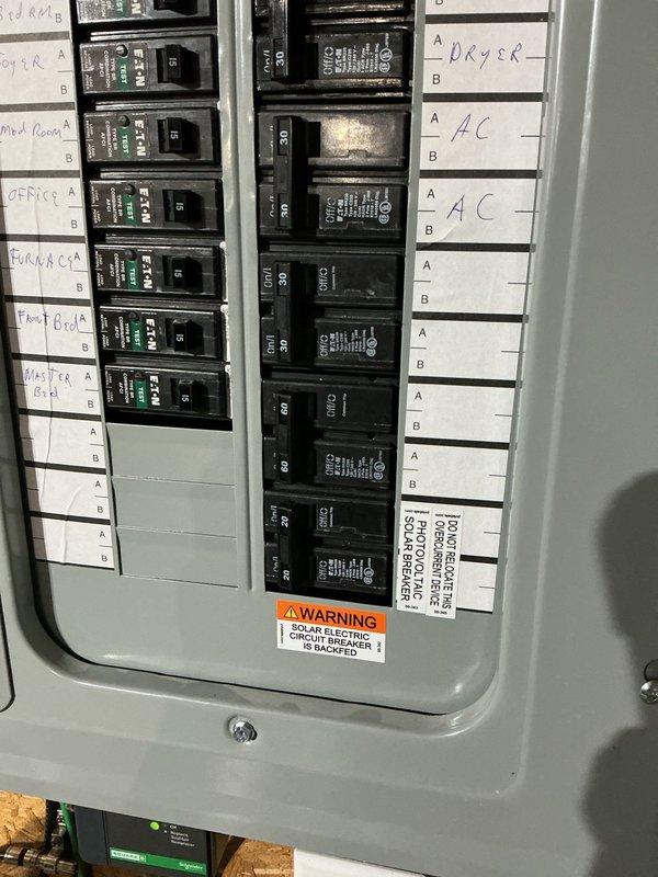 Responded to service call for circuit overloading issues caused by tank heater and EV charger exceeding panel capacity. Performed electrical load assessment and determined existing breaker configuration was insufficient for increased power demands. Reconfigured circuit breakers within main electrical panel, relocated and balanced circuits to distribute load more effectively across available phases. Installed whole-home surge protection device to protect electrical system and connected equipment from power surges. Verified all breaker connections, torqued terminals to manufacturer specifications, and tested system under load to ensure stable operation. Updated panel directory with accurate circuit labels for dryer, AC units, and other major appliances. All work completed to NEC standards with proper wire sizing and overcurrent protection in place.
