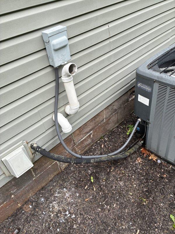 Conducted comprehensive assessment of existing HVAC system for full replacement estimate. Evaluated outdoor condensing unit positioned on exterior wall with proper clearance and documented current refrigerant line configuration, electrical disconnect box, and PVC conduit installation. Inspected indoor air handler unit in mechanical room, noting refrigerant line routing, service port accessibility, and current ductwork connections. Presented multiple complete system replacement options to address equipment age and performance needs, confirming straightforward installation access for both indoor and outdoor components.