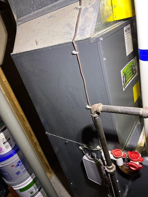 Conducted comprehensive assessment of existing HVAC system for full replacement estimate. Evaluated outdoor condensing unit positioned on exterior wall with proper clearance and documented current refrigerant line configuration, electrical disconnect box, and PVC conduit installation. Inspected indoor air handler unit in mechanical room, noting refrigerant line routing, service port accessibility, and current ductwork connections. Presented multiple complete system replacement options to address equipment age and performance needs, confirming straightforward installation access for both indoor and outdoor components.