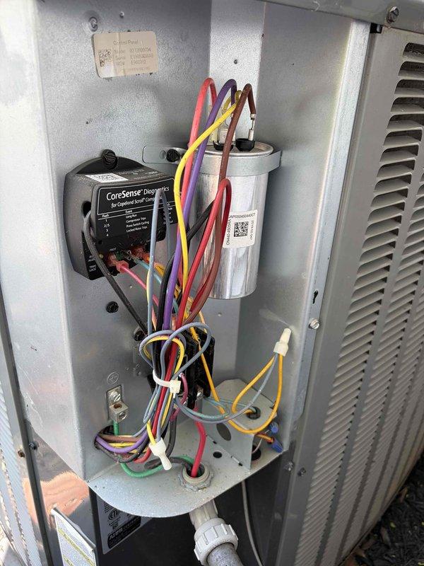 Performed comprehensive cooling system tune-up on residential HVAC unit. Inspected and tested electrical components including capacitor, CoreSense control module, and all associated wiring connections to ensure proper operation and system efficiency. All components found to be functioning within normal parameters; system ready for cooling season operation.