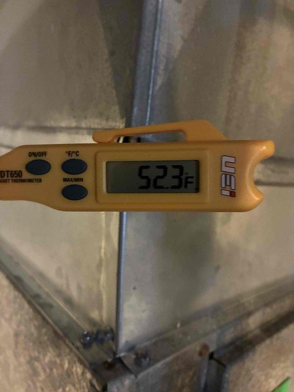 Responded to no cooling call on 15+ year old central air conditioning system. Upon arrival, found outdoor condensing unit failed to energize when thermostat called for cooling. Performed electrical diagnostics using clamp meter to test power supply and component functionality at the outdoor unit. Measured supply air temperature at ductwork, which registered 52.3°F, confirming lack of cooling operation. Tested thermostat signal, contactor operation, and compressor circuit. Determined system failure due to age-related component degradation on equipment beyond expected service life. Discussed repair versus replacement options with customer given unit age and condition. Documented electrical readings and temperature measurements for customer records.