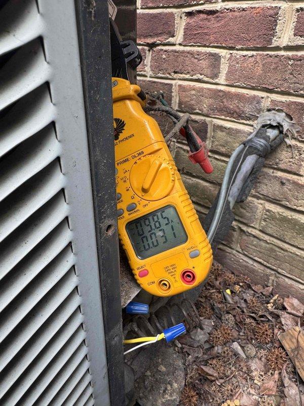 Responded to no cooling complaint on Ameristar condensing unit model 67M303GA100DAA. Upon arrival, performed electrical diagnostics using digital multimeter to assess system operation and measured voltage and amperage readings at the outdoor unit. Verified unit specifications and conducted troubleshooting procedures to identify the cause of the cooling failure.
