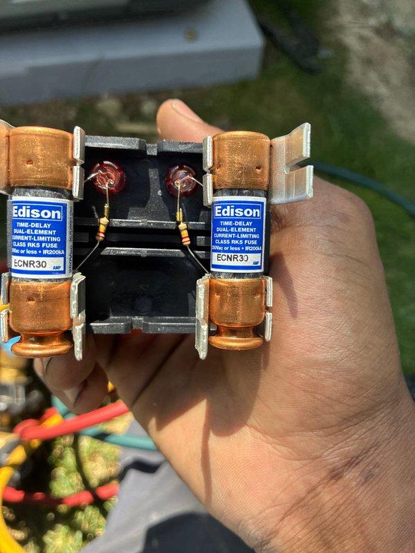 Completed installation of new air conditioning system. Installed ECNR30 Class RK5 dual-element time-delay fuses for electrical protection and verified proper system pressures and refrigerant charge using calibrated digital gauges, confirming R32 refrigerant operating within manufacturer specifications.