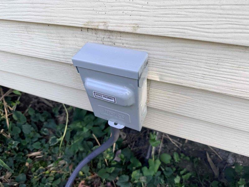 Responded to emergency no cooling call for central air conditioning system. Upon arrival, discovered severely deteriorated electrical wiring and damaged conduit at exterior disconnect box serving the outdoor condensing unit. Wire insulation had completely disintegrated, exposing internal conductors with evidence of charring and weather damage. Junction box showed signs of corrosion and the electrical connection posed an immediate safety hazard. Documented extensive wire damage with photographs showing compromised insulation, exposed conductors, and deteriorated protective sheathing. Advised customer that the damaged electrical supply wiring required immediate replacement before air conditioning system could be safely restored to operation.