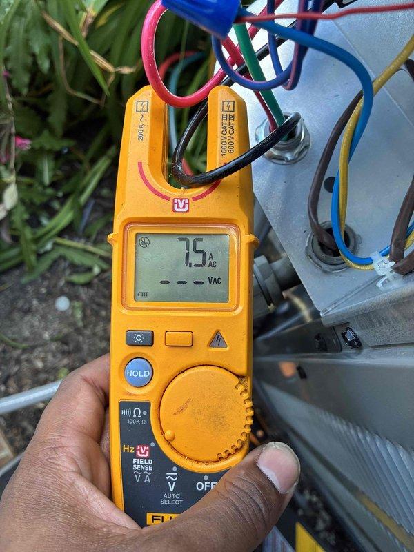 Completed air conditioning system installation with comprehensive electrical verification. Performed voltage and amperage testing on all electrical connections, confirming proper system operation with readings of 7.5 VAC and 9.0 AAC at critical components. All electrical connections secured and system commissioned successfully.