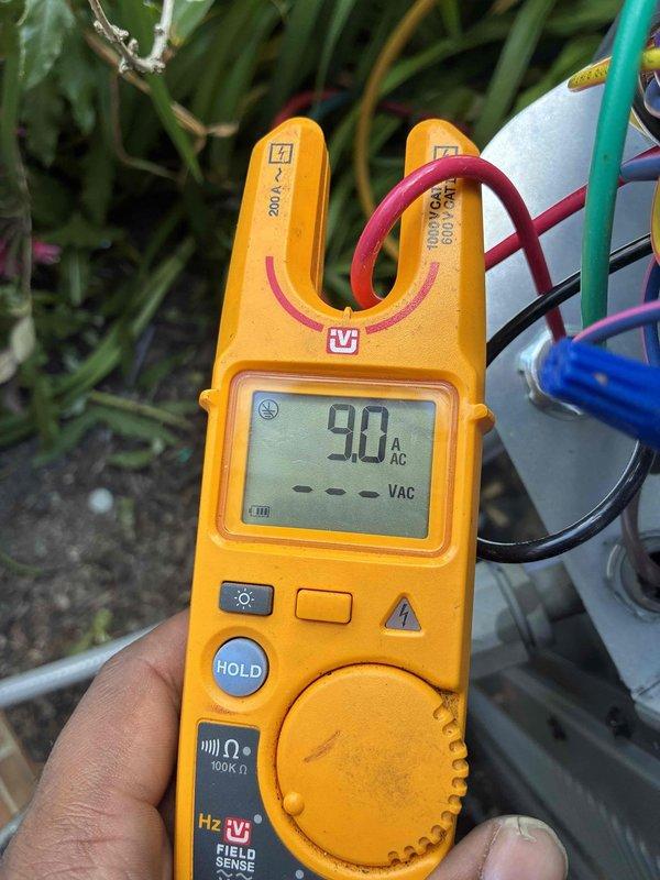 Completed air conditioning system installation with comprehensive electrical verification. Performed voltage and amperage testing on all electrical connections, confirming proper system operation with readings of 7.5 VAC and 9.0 AAC at critical components. All electrical connections secured and system commissioned successfully.