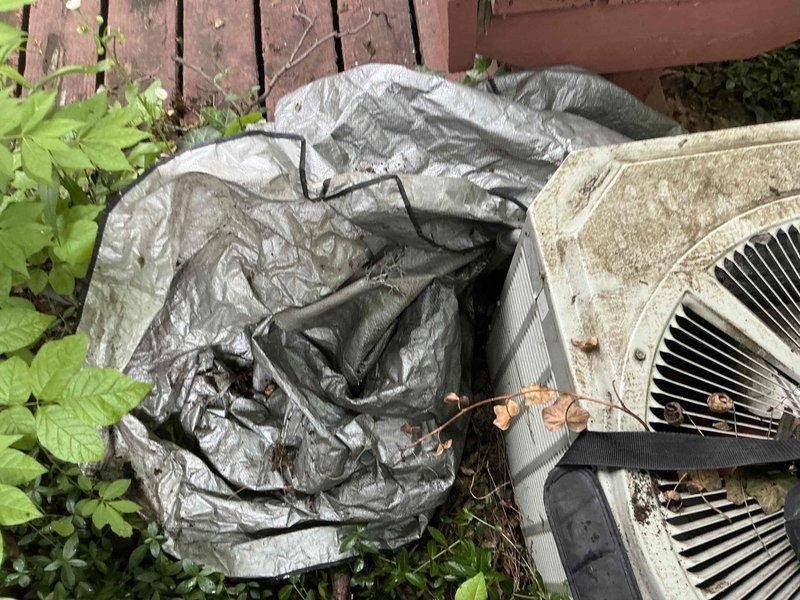 Conducted comprehensive assessment of existing HVAC system for replacement estimate. Evaluated indoor Trane XE 8 furnace unit located in basement utility area and outdoor air conditioning condenser units showing significant weathering and age-related deterioration. Documented current equipment condition, including visible rust, debris accumulation, and protective covering on outdoor units. Photographed existing installation configuration, ductwork connections, and equipment placement to provide accurate replacement options and specifications for complete system upgrade.