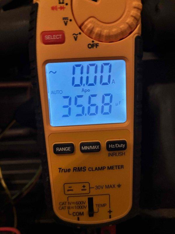 Completed comprehensive cooling maintenance on Carrier residential HVAC system. Performed standard preventive maintenance procedures including inspection of furnace unit, electrical connections, and system components. Utilized digital clamp meter to verify electrical readings and measure capacitance values, confirming system operating within normal parameters at 356.8 microfarads.