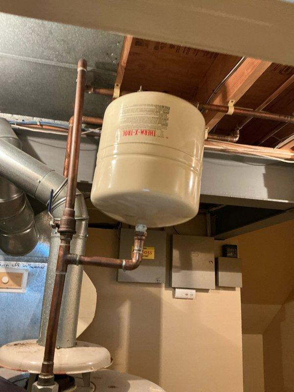 Conducted comprehensive site evaluation for full HVAC system replacement with zoned configuration. Assessed existing mechanical infrastructure including hydronic expansion tank, copper piping network, ductwork, and electrical panel capacity to determine compatibility requirements for new multi-zone heating and cooling system installation.