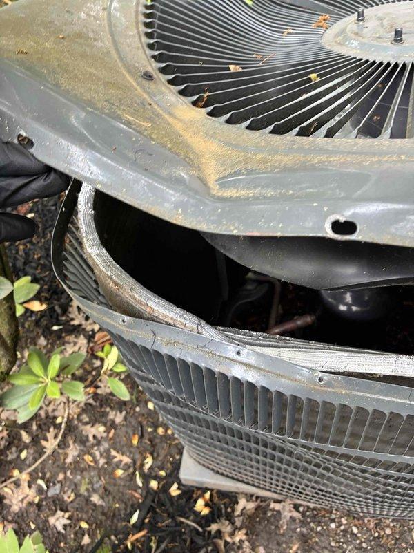Responded to service call for air conditioning unit damaged by falling ice. Upon arrival, inspected outdoor condenser unit and documented visible denting to exterior housing and abnormal operational noise during system runtime. Collected diagnostic fee and photographed equipment condition showing impact damage to metal casing and potential fan assembly issues requiring further assessment or replacement of damaged components.