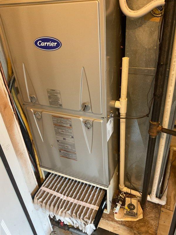 # HVAC Cooling Maintenance Summary

Completed comprehensive seasonal cooling maintenance on residential Carrier HVAC system as part of recurring preventive maintenance program. Performed full inspection of indoor furnace unit and outdoor condenser unit, verified proper operation of all components, and documented system condition through photographic records.

---

## Work Performed

**Indoor Unit Inspection:**
- Inspected Carrier furnace unit located in utility closet
- Examined air filter and heat exchanger condition
- Verified proper clearances and access panel integrity
- Checked condensate drain lines and PVC piping system
- Inspected electrical conduit connections and wiring
- Confirmed all safety labels and technical specification plates are legible and intact

**Outdoor Unit Inspection:**
- Inspected Carrier condenser unit positioned on composite pad
- Examined cabinet condition and top grille assembly
- Verified fan operation and proper airflow
- Checked refrigerant line connec