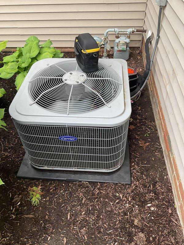 # HVAC Cooling Maintenance Summary

Completed comprehensive seasonal cooling maintenance on residential Carrier HVAC system as part of recurring preventive maintenance program. Performed full inspection of indoor furnace unit and outdoor condenser unit, verified proper operation of all components, and documented system condition through photographic records.

---

## Work Performed

**Indoor Unit Inspection:**
- Inspected Carrier furnace unit located in utility closet
- Examined air filter and heat exchanger condition
- Verified proper clearances and access panel integrity
- Checked condensate drain lines and PVC piping system
- Inspected electrical conduit connections and wiring
- Confirmed all safety labels and technical specification plates are legible and intact

**Outdoor Unit Inspection:**
- Inspected Carrier condenser unit positioned on composite pad
- Examined cabinet condition and top grille assembly
- Verified fan operation and proper airflow
- Checked refrigerant line connec