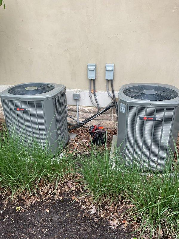Completed scheduled cooling maintenance on dual HVAC system consisting of two Trane outdoor condensing units and indoor air handler components. Performed comprehensive inspection of both outdoor units including cleaning of condenser coils, verification of refrigerant levels, testing of compressor operation, and inspection of electrical connections and disconnect boxes. Inspected indoor furnace and air handler assembly, verified proper airflow through ductwork, and checked condensate drain lines for proper drainage. All system components were found to be operating within normal parameters, electrical connections were secure, and both units demonstrated proper cooling cycle operation upon completion of maintenance procedures.