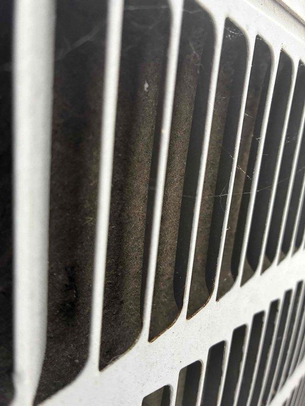 Completed scheduled preventative maintenance on residential cooling system. Upon inspection, condenser unit fins showed significant accumulation of dirt, dust, and debris restricting airflow. Thoroughly cleaned condenser coils and fins to restore optimal heat transfer efficiency and system performance.