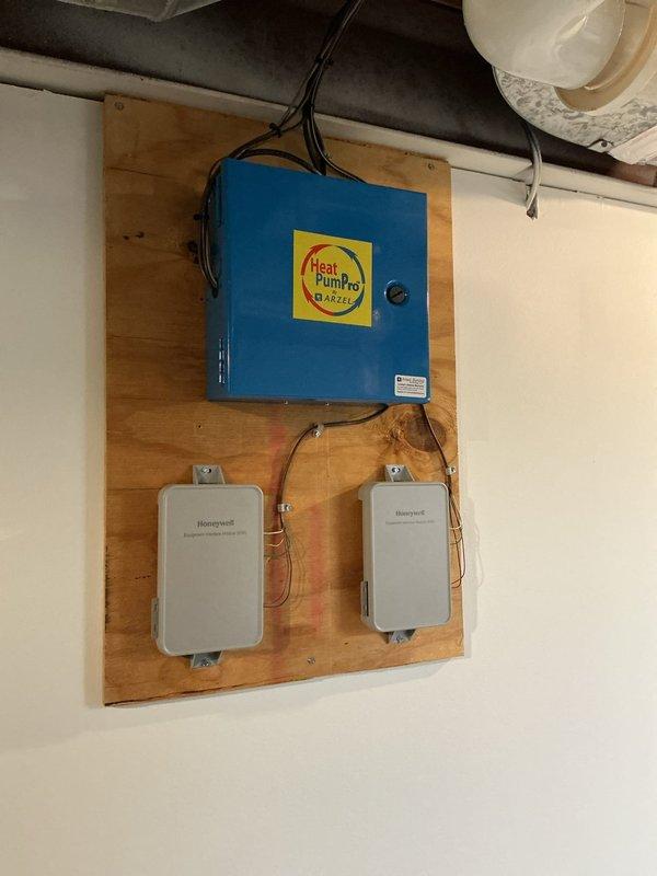 Completed scheduled cooling maintenance visit on HVAC system. Performed comprehensive inspection of heat pump control equipment, including HeatPumpPro controller and associated Honeywell relay modules, verifying proper electrical connections and operational status. Documented system configuration and confirmed all components functioning within normal parameters.