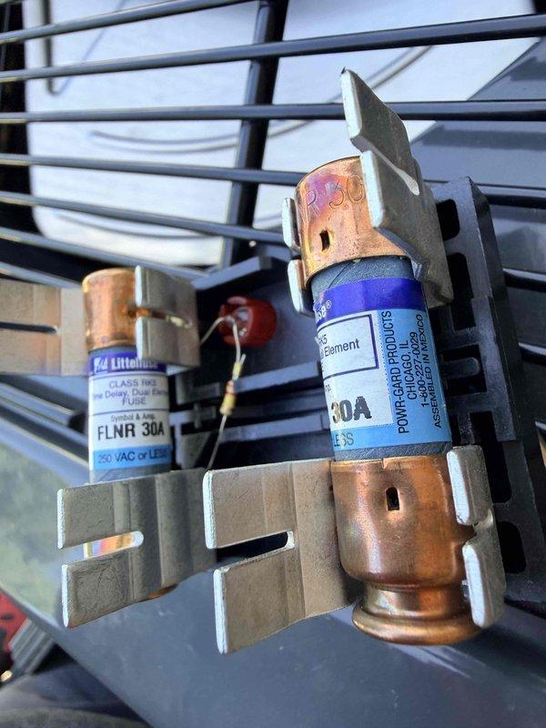 Responded to service call for furnace inspection preparation. Installed 30-amp Littelfuse in exterior fuse holder assembly to ensure proper electrical protection and code compliance for upcoming inspection.