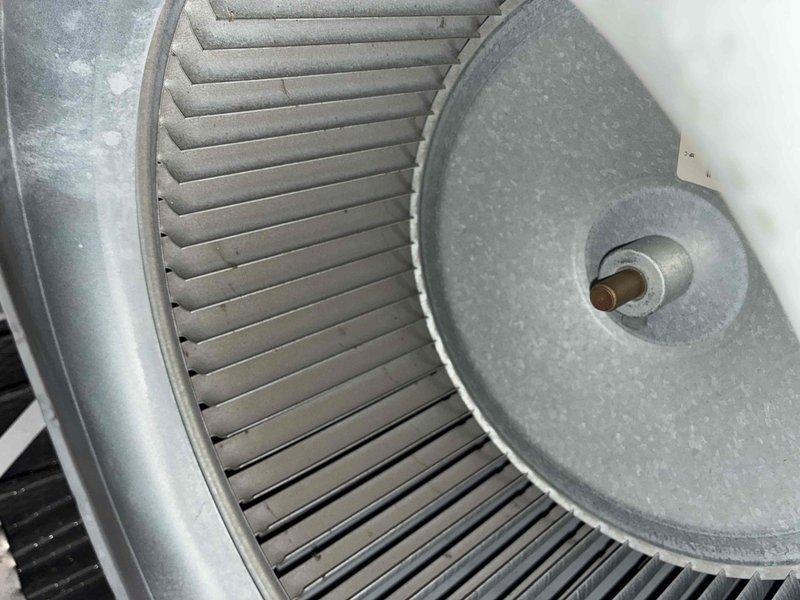 Completed scheduled cooling system maintenance visit. Inspected and serviced blower wheel assembly, which showed light dust accumulation but remained in functional condition. Performed standard preventive maintenance procedures on HVAC equipment to ensure optimal system performance for the cooling season.