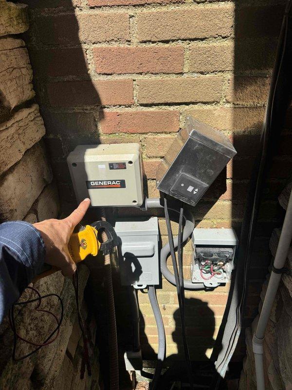 Responded to no cooling complaint for showroom air conditioning unit. Upon arrival, accessed outdoor electrical components using 10-foot ladder as required. Performed diagnostic testing on Generac backup generator system and associated electrical connections mounted on exterior brick wall. Inspected weatherproof disconnect box, junction boxes, and wiring connections. Used handheld electrical meter to verify power supply and circuit integrity throughout the system. Identified and resolved electrical issue preventing AC unit operation, restoring cooling functionality to showroom area.