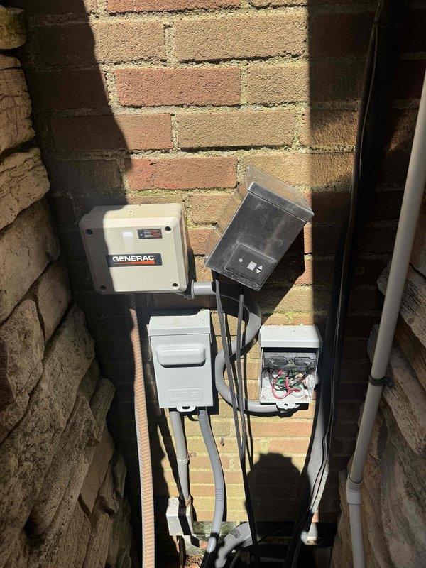 Responded to no cooling complaint for showroom air conditioning unit. Upon arrival, accessed outdoor electrical components using 10-foot ladder as required. Performed diagnostic testing on Generac backup generator system and associated electrical connections mounted on exterior brick wall. Inspected weatherproof disconnect box, junction boxes, and wiring connections. Used handheld electrical meter to verify power supply and circuit integrity throughout the system. Identified and resolved electrical issue preventing AC unit operation, restoring cooling functionality to showroom area.