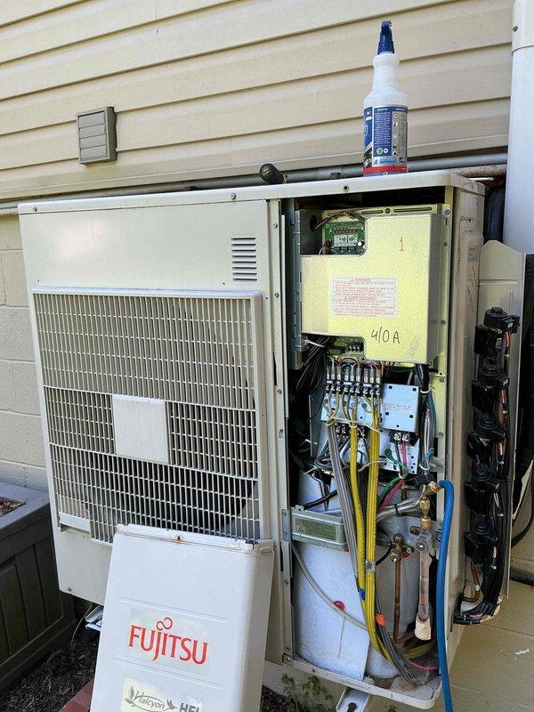 Responded to service call for one or two Fujitsu mini-split systems reported as not working properly. Upon arrival, performed visual inspection and diagnostic evaluation of outdoor condenser unit. Opened service panel to access internal components including refrigerant lines, electrical controls, and circuit boards. Verified system operates on R-410A refrigerant as indicated on unit specifications. Inspected copper refrigerant lines, electrical connections, and control wiring for visible damage or loose connections. Documented equipment condition and configuration through photographic records for service history. Completed system assessment and provided recommendations for proper operation.