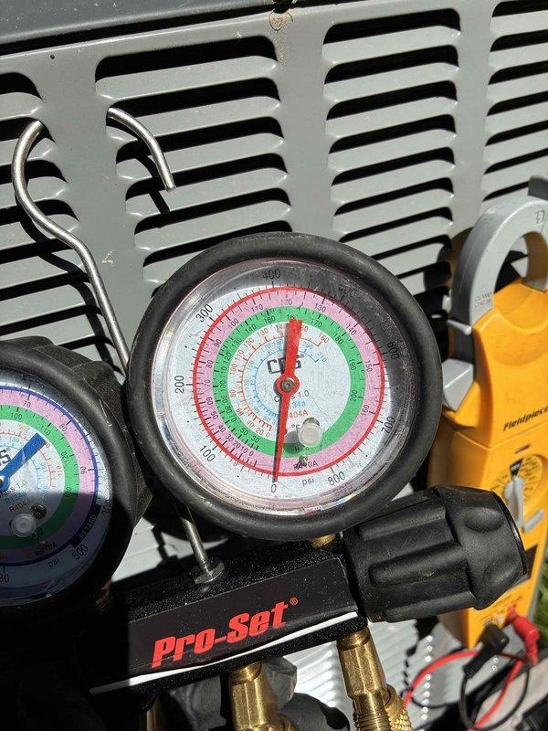 Responded to no cooling complaint. Connected manifold gauge set to measure system pressures and diagnose air conditioning unit. Performed refrigerant pressure analysis to determine system operating conditions and identify cause of failure.
