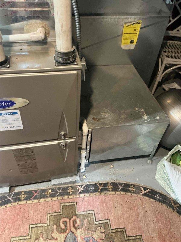 Conducted estimate for air conditioning system replacement after unit sustained severe damage from ice accumulation during winter months. Existing Carrier furnace and indoor components were inspected and documented, with outdoor condensing unit requiring complete replacement due to structural damage. Provided customer with equipment options and replacement recommendations for new outdoor AC unit compatible with current indoor system.