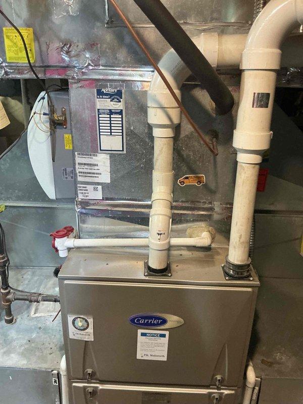 Conducted estimate for air conditioning system replacement after unit sustained severe damage from ice accumulation during winter months. Existing Carrier furnace and indoor components were inspected and documented, with outdoor condensing unit requiring complete replacement due to structural damage. Provided customer with equipment options and replacement recommendations for new outdoor AC unit compatible with current indoor system.